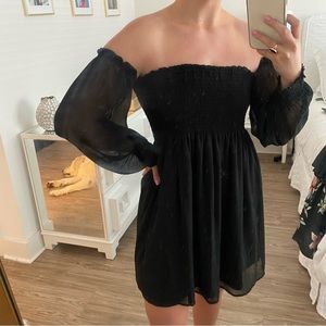 Black dress with off the shoulder sheer sleeves